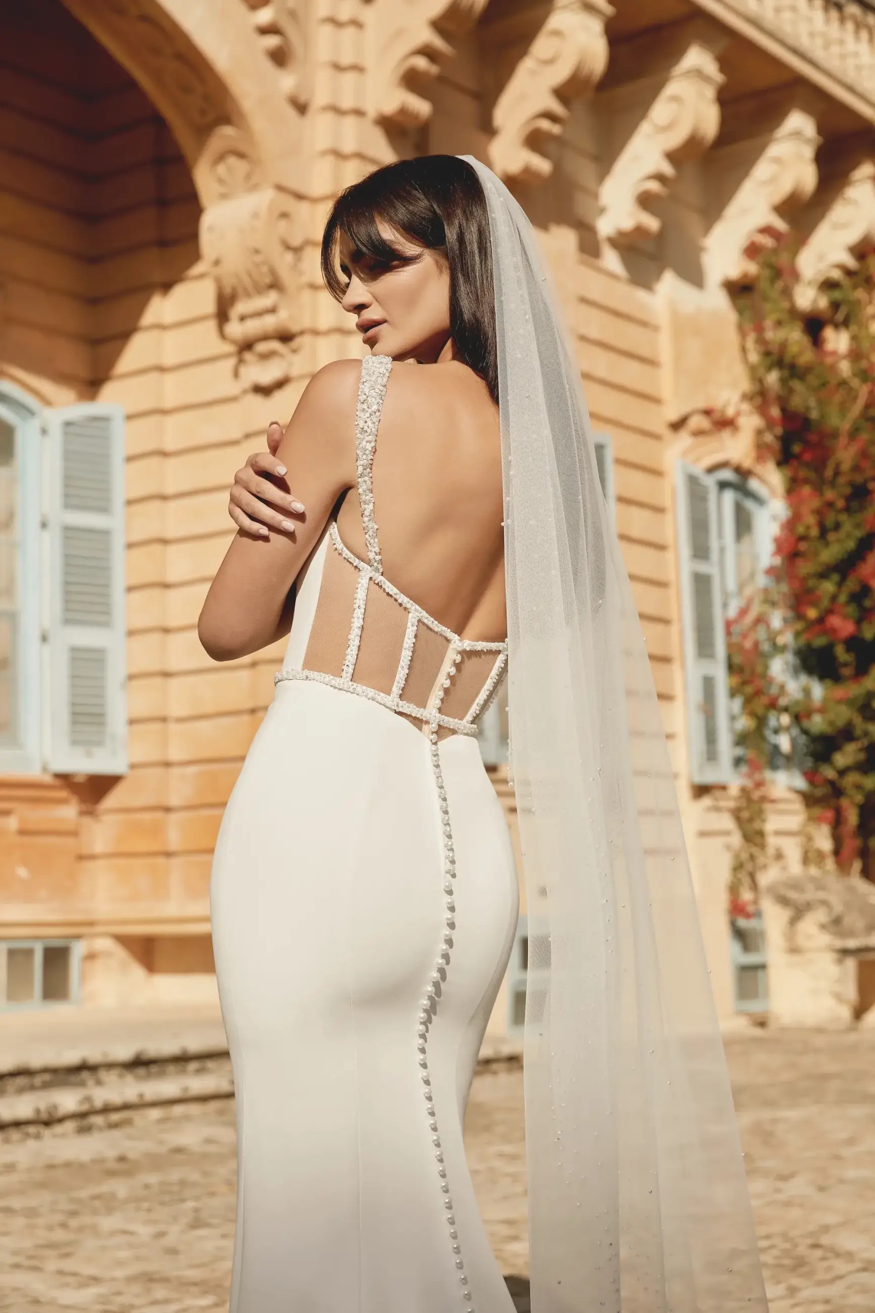 model wearing a crepe wedding dress from justin alexander sincerity