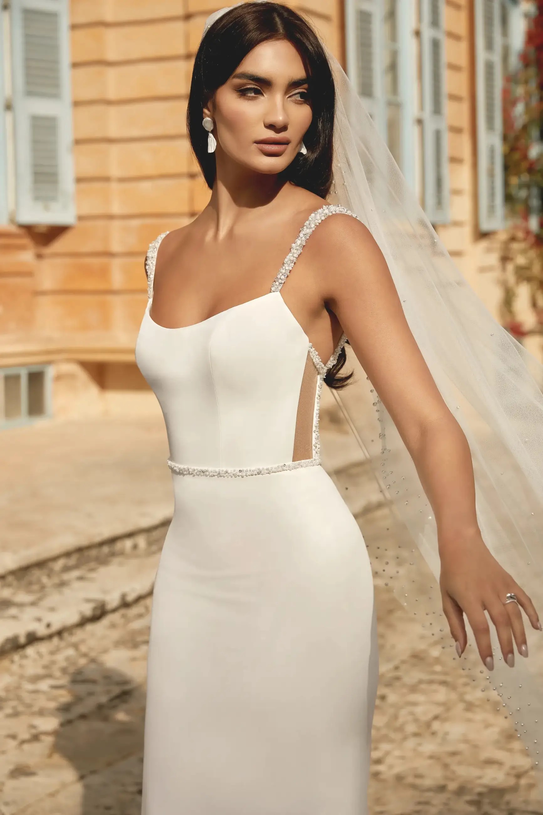 model wearing a crepe wedding dress from justin alexander sincerity