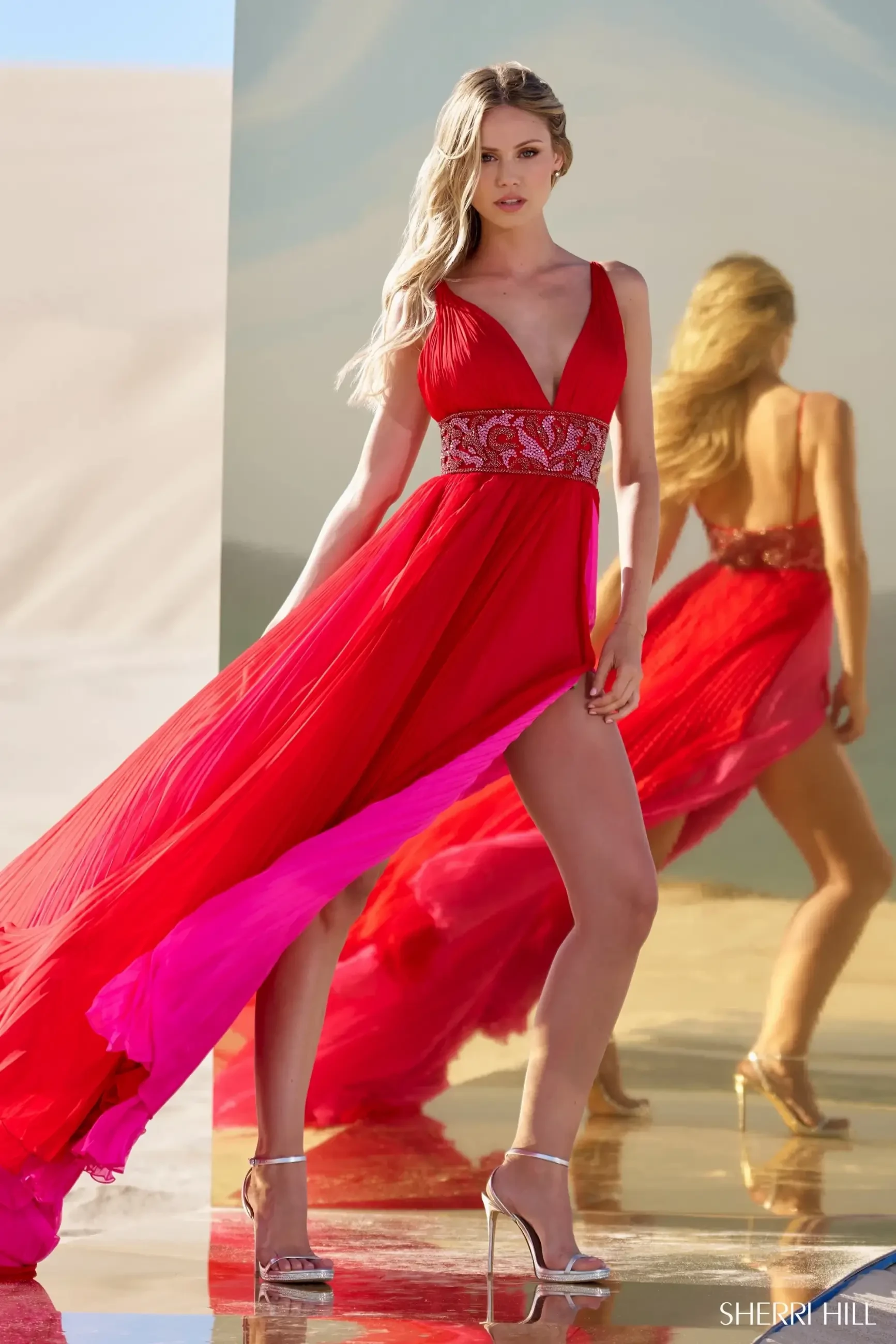 model is wearing a sleeveless a-line floor length evening gown by sherri hill