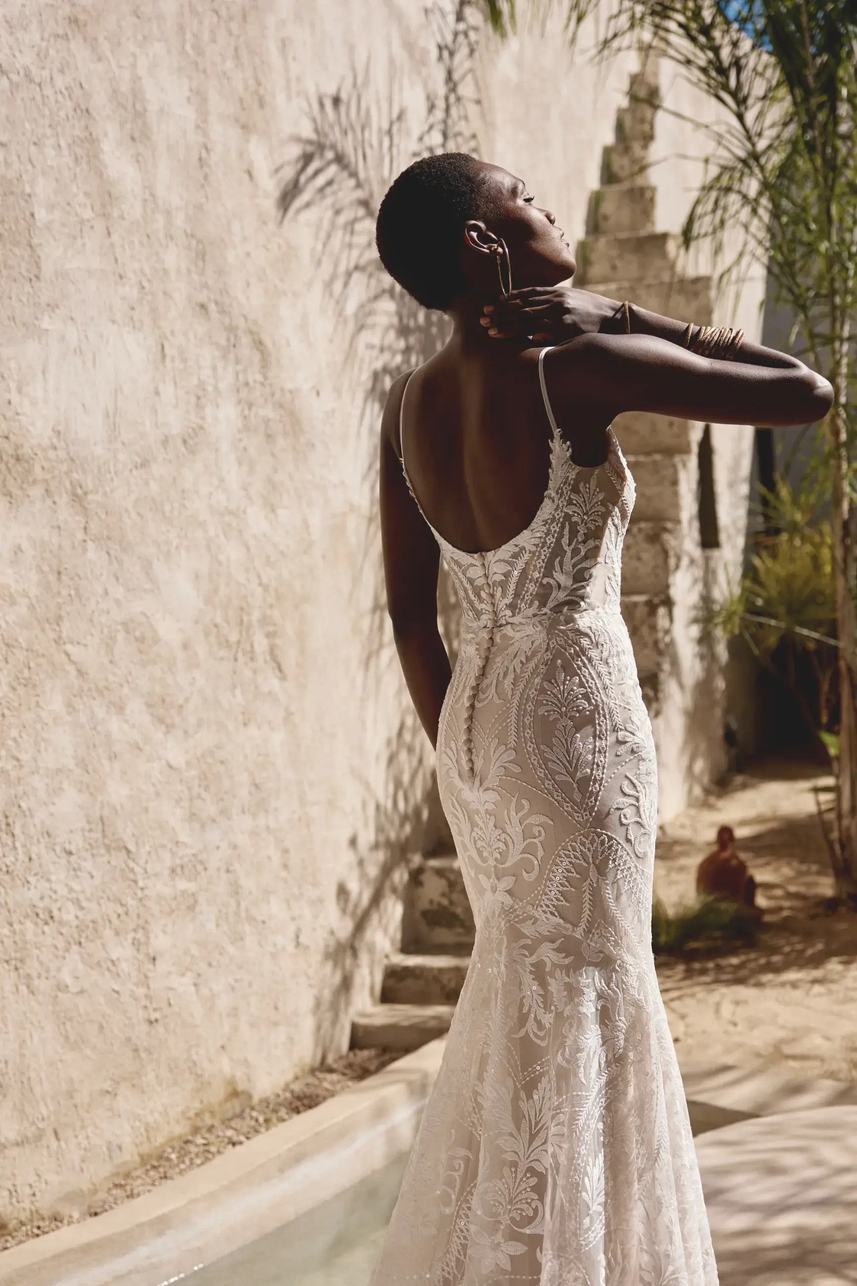 Model wearing a lace wedding dress from Lillian West