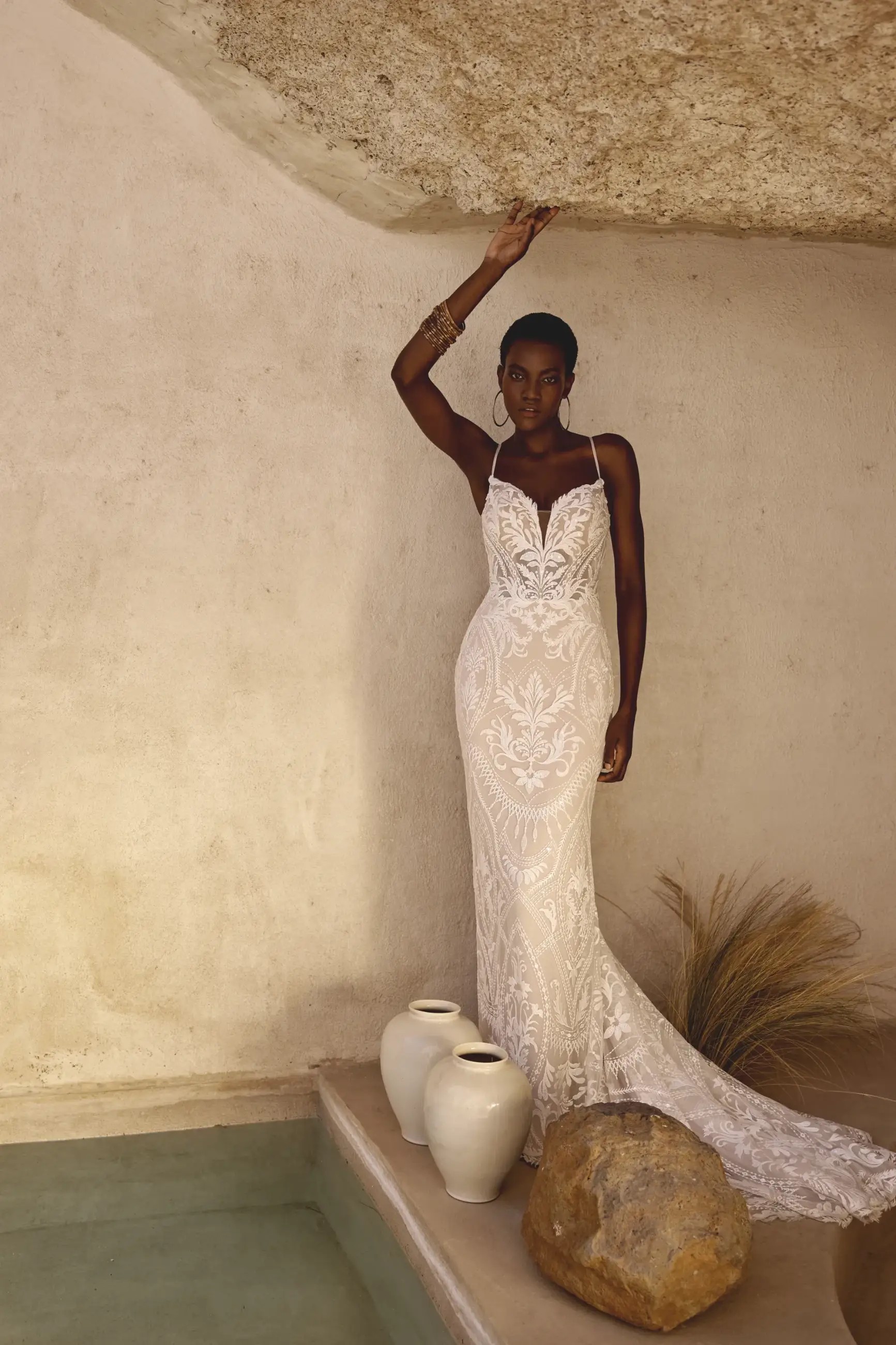 Model wearing a lace wedding dress from Lillian West